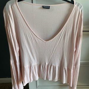 Large, light pink blouse.